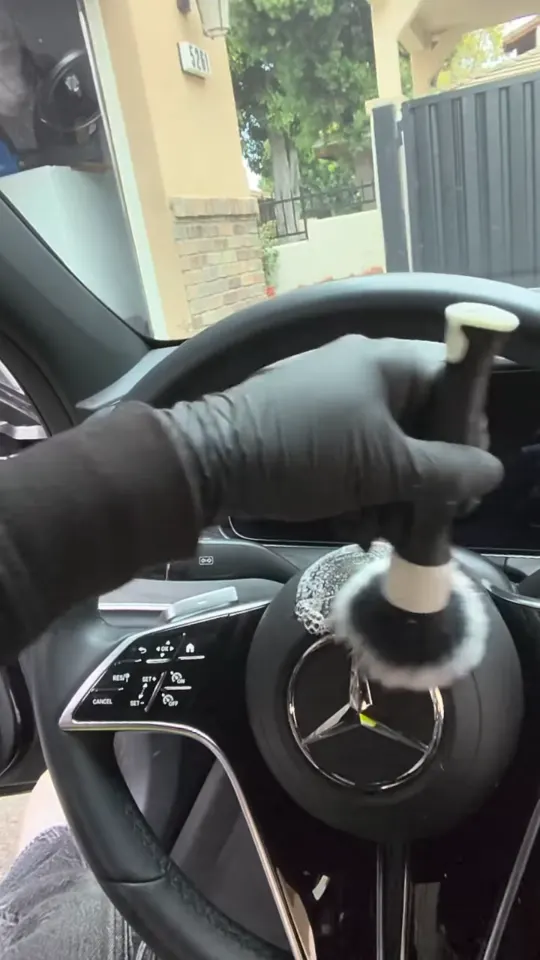 Brushing the steering wheel of a Mercedes-Benz