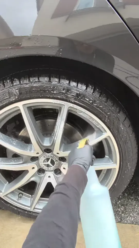 Spraying wheel cleaner on a Mercedes-Benz alloy wheel