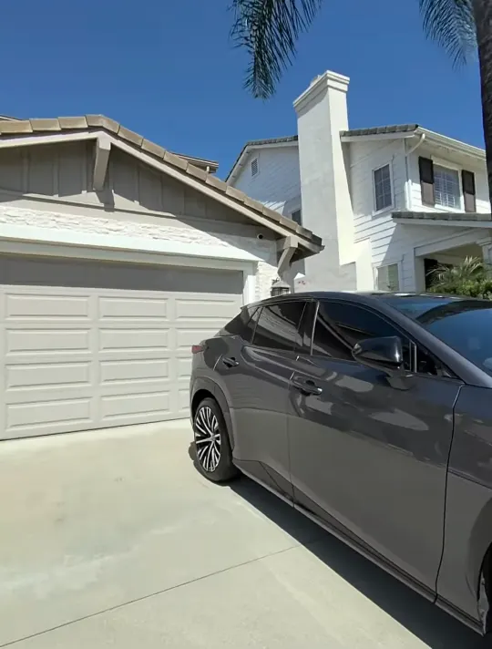 Gray Lexus SUV parked in the driveway after water spot removal