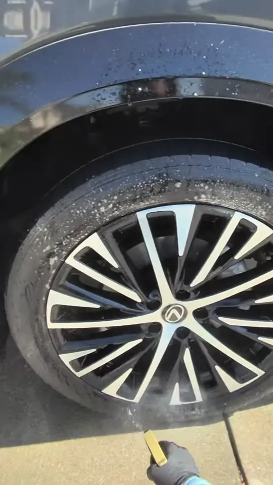 Scrubbing a Lexus wheel and tire
