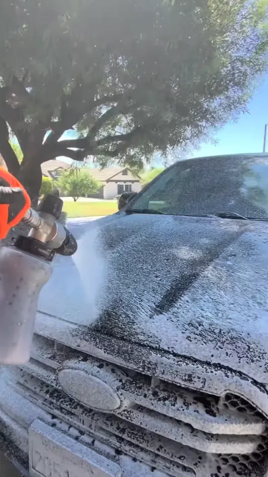 Foam covering the hood and grille of a black Ford Ranger